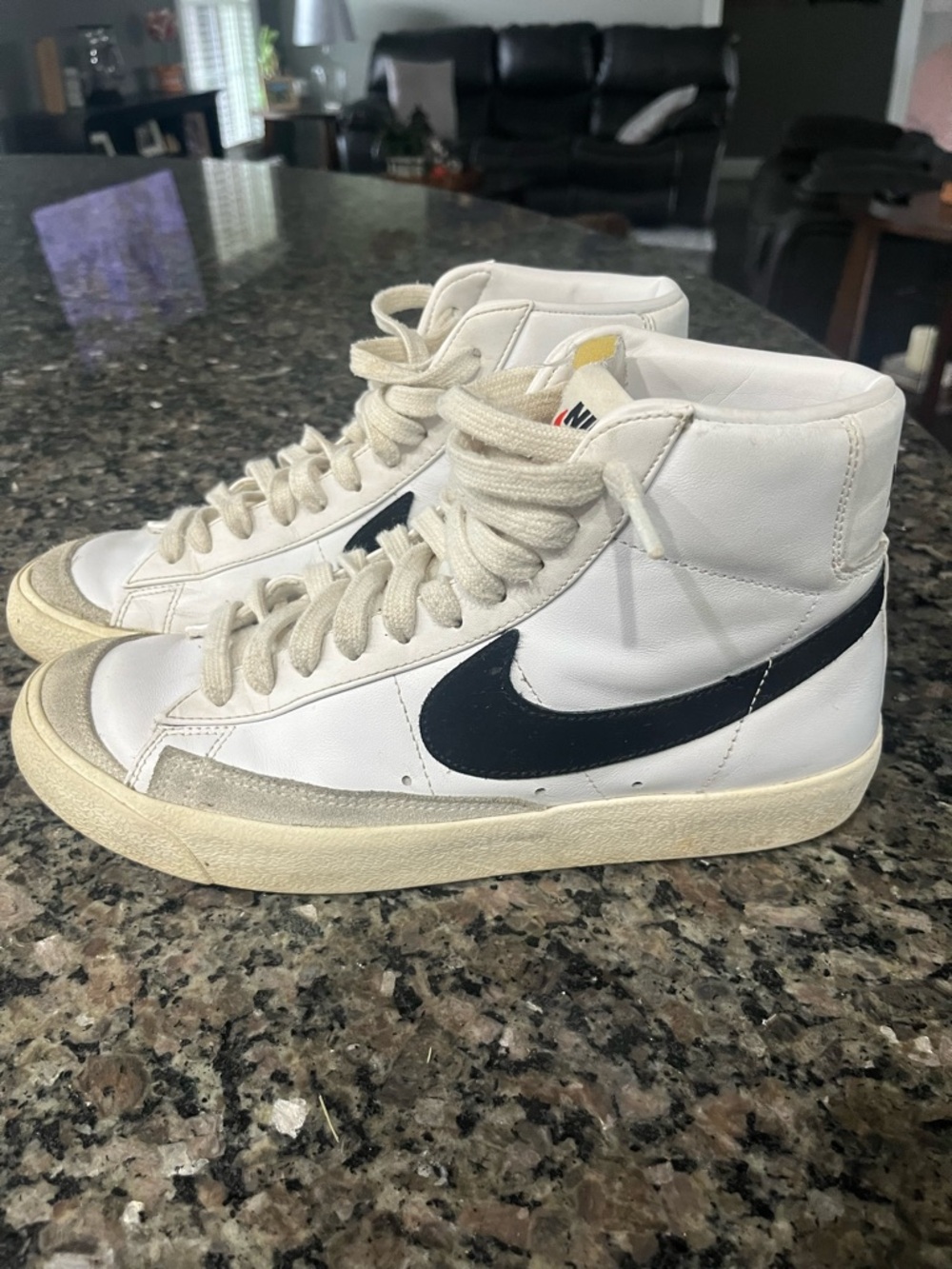 Nike White High-Top Sneakers with Black Swoosh